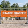 Bâche sur mesure posée sur un grillage de chantier