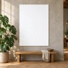 Affiche personnalisée A0 au format portrait, accrochée au-dessus d’un banc en bois dans un loft, à côté d’un monstera